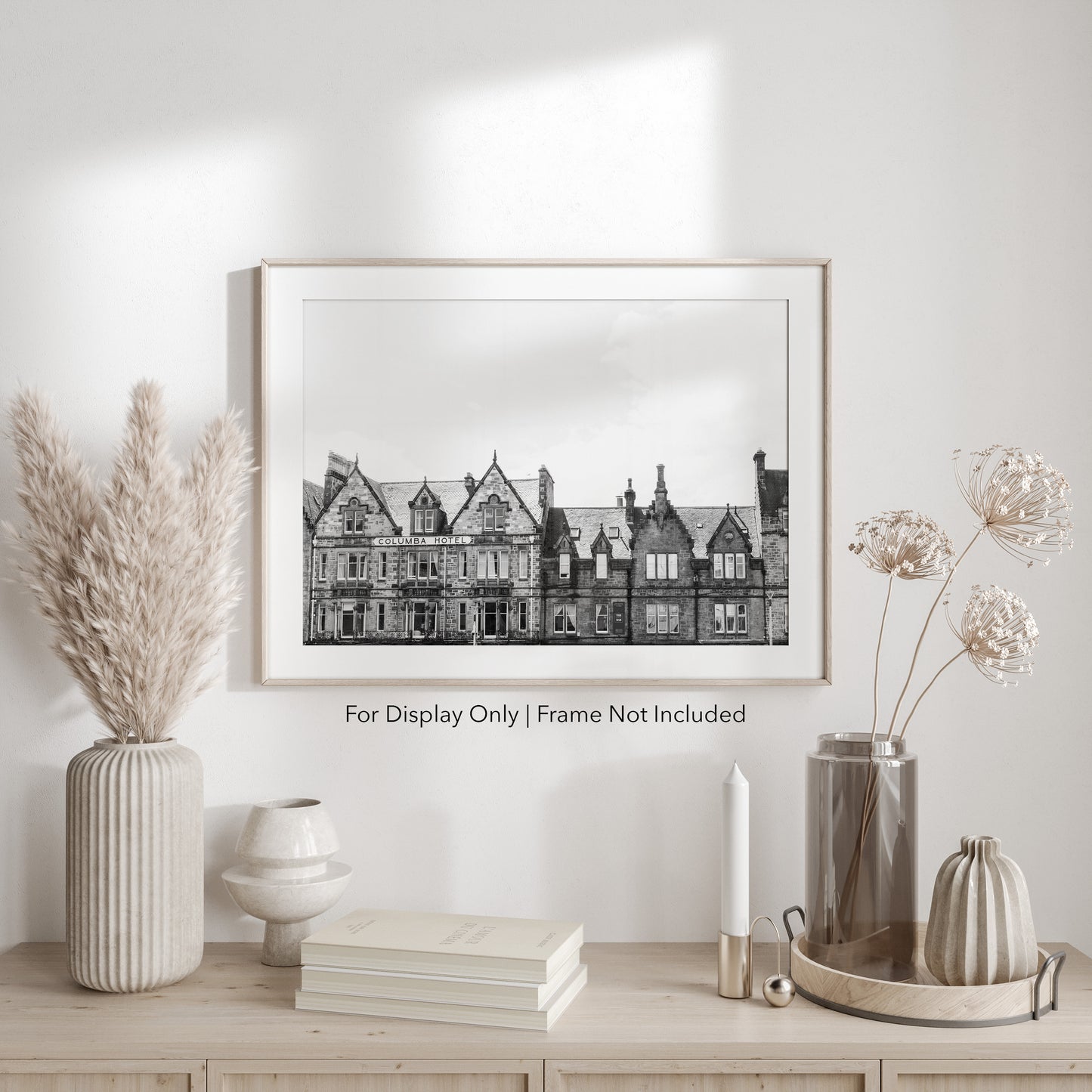 Black and white photograph of the historic Columba Hotel building in Inverness, Scotland, with stone architecture and gabled rooftops.