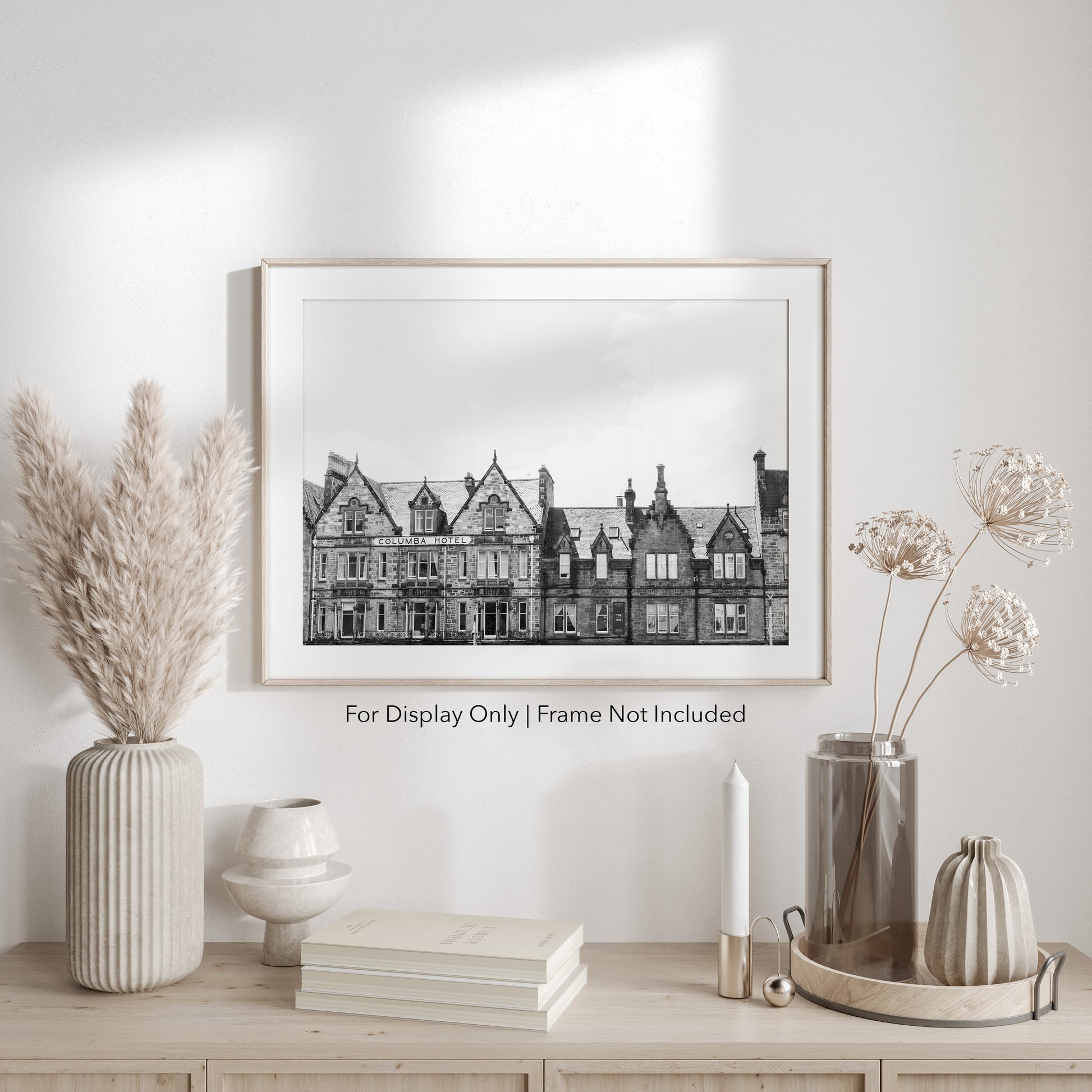 Black and white photograph of the historic Columba Hotel building in Inverness, Scotland, with stone architecture and gabled rooftops.