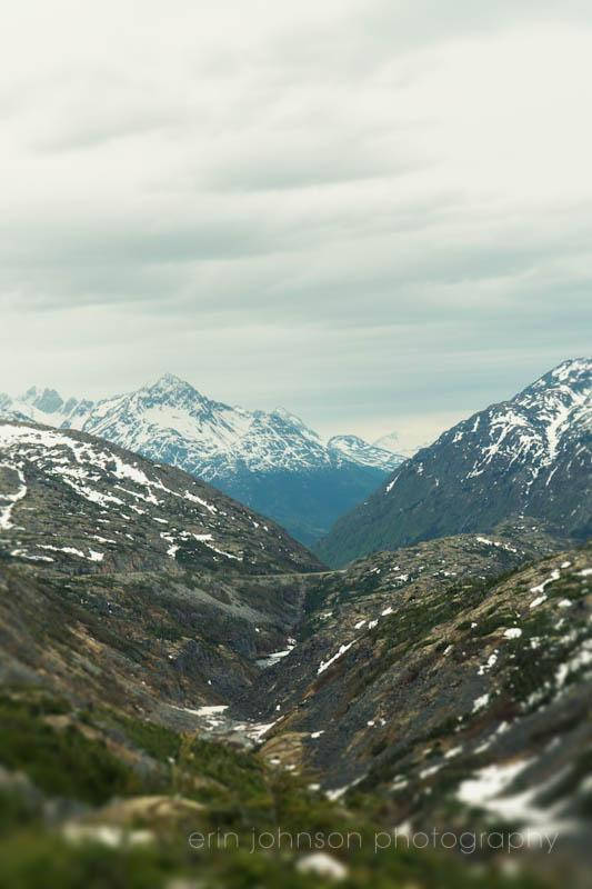 a view of a mountain range with snow on the mountains