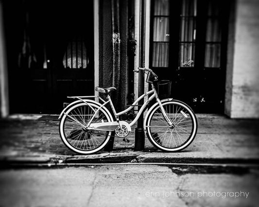 a bicycle parked on the side of a street