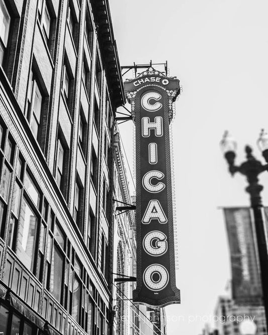 a black and white photo of a chicago sign