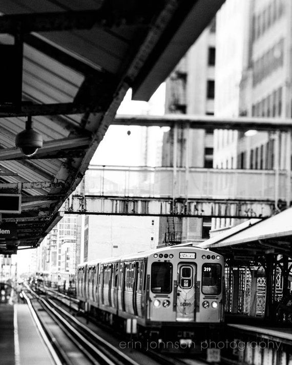a black and white photo of a train at a train station