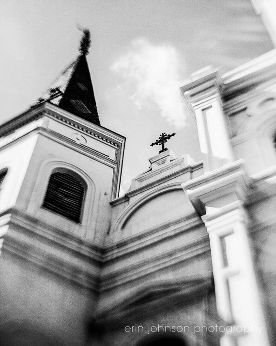 Black and white photograph of St. Louis Cathedral in Jackson Square, New Orleans, with a focus on architectural details.