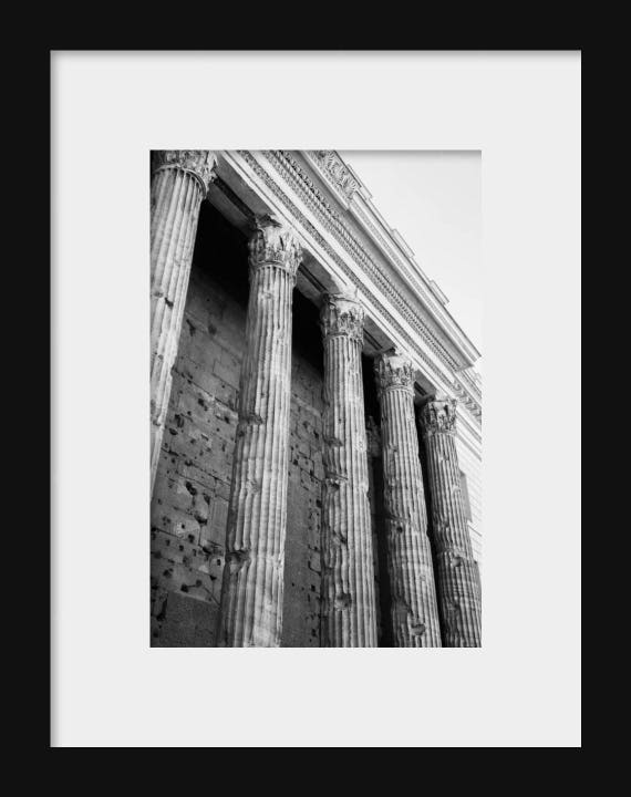 Black and white photograph of Roman columns in Rome, Italy, perfect for travel-inspired wall art and home décor.