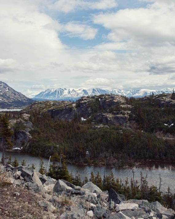 Snow-capped mountains along the Klondike Highway in British Columbia, Canada – landscape photography print.