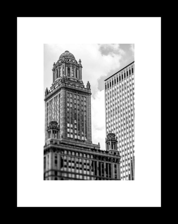 Black and white photograph of the Jeweler’s Building, featuring neoclassical architecture, with a modern skyscraper in the background in Chicago.