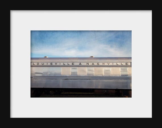 Photograph of the Louisville and Nashville train under a blue sky, perfect for industrial wall art and travel-inspired home décor.