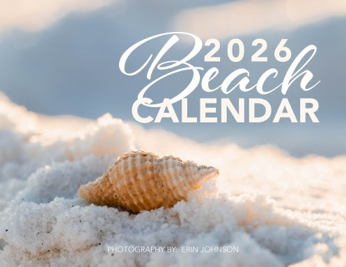 2026 Beach Wall Calendar with a shell on sand and water in the background