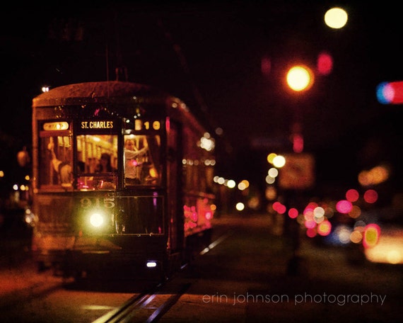 A photograph of the St Charles Streetcar at night in New Orleans, Lousiana.
