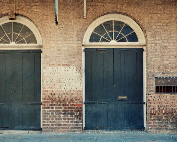 Photography print of blue doors in the heart of the French Quarter in New Orleans Louisiana.