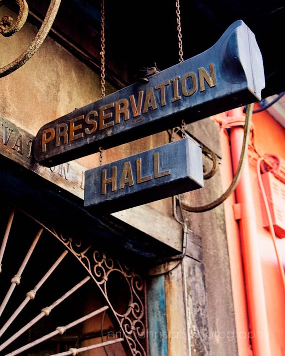 A color photograph of a 'Preservation Hall' sign in New Orleans, Louisiana