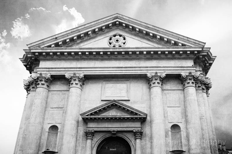 Black and white photograph of the San Barnaba Church in Venice, Italy, showing the front facade with classical architectural elements.