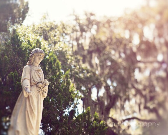 a statue of a woman holding a bouquet of flowers