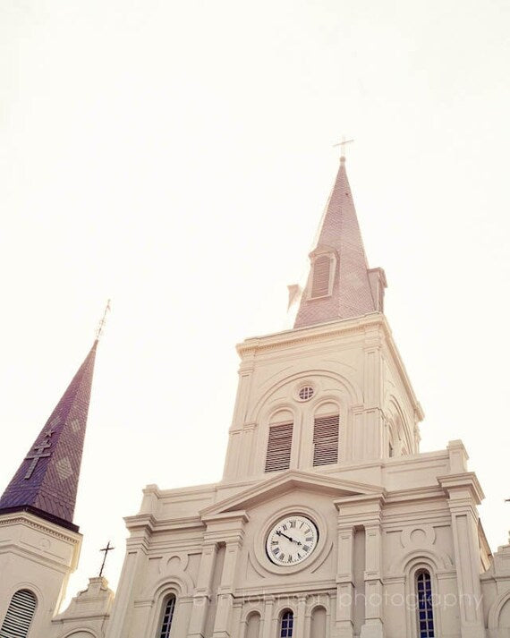 St. Louis Cathedral in Jackson Square, New Orleans, white architectural photography capturing the elegance of the French Quarter, perfect for Louisiana-inspired home décor.
