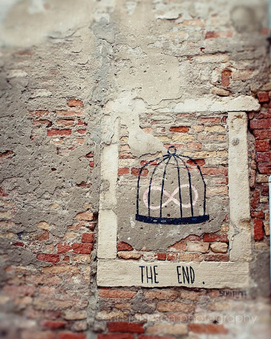 Graffiti artwork reading “The End” on a weathered brick wall in Venice, Italy – fine art travel photography print for wall art decor.