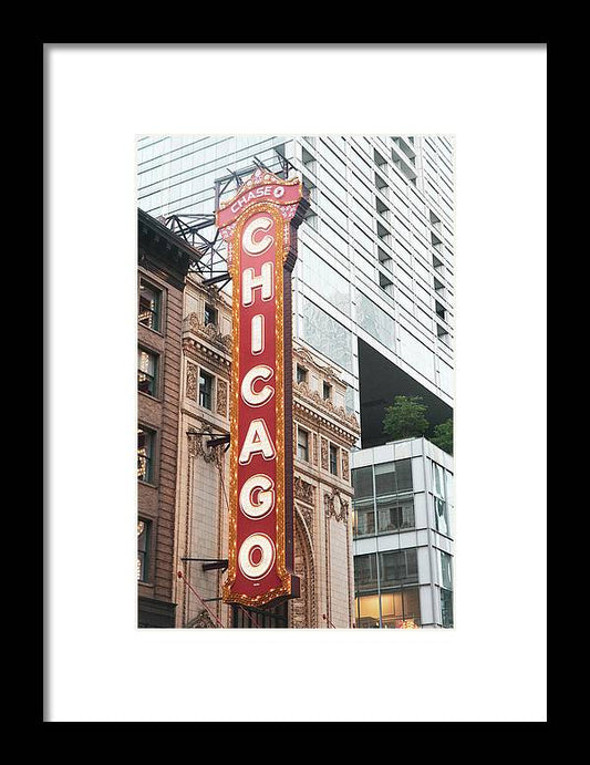 a chicago theater sign in front of a tall building