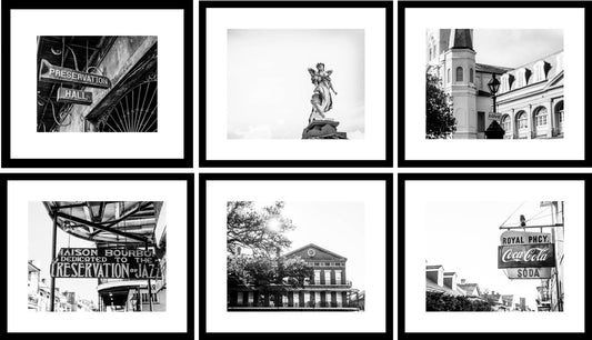 A set of six black and white photography prints of New Orleans scenes arranged in a grid pattern on a wall