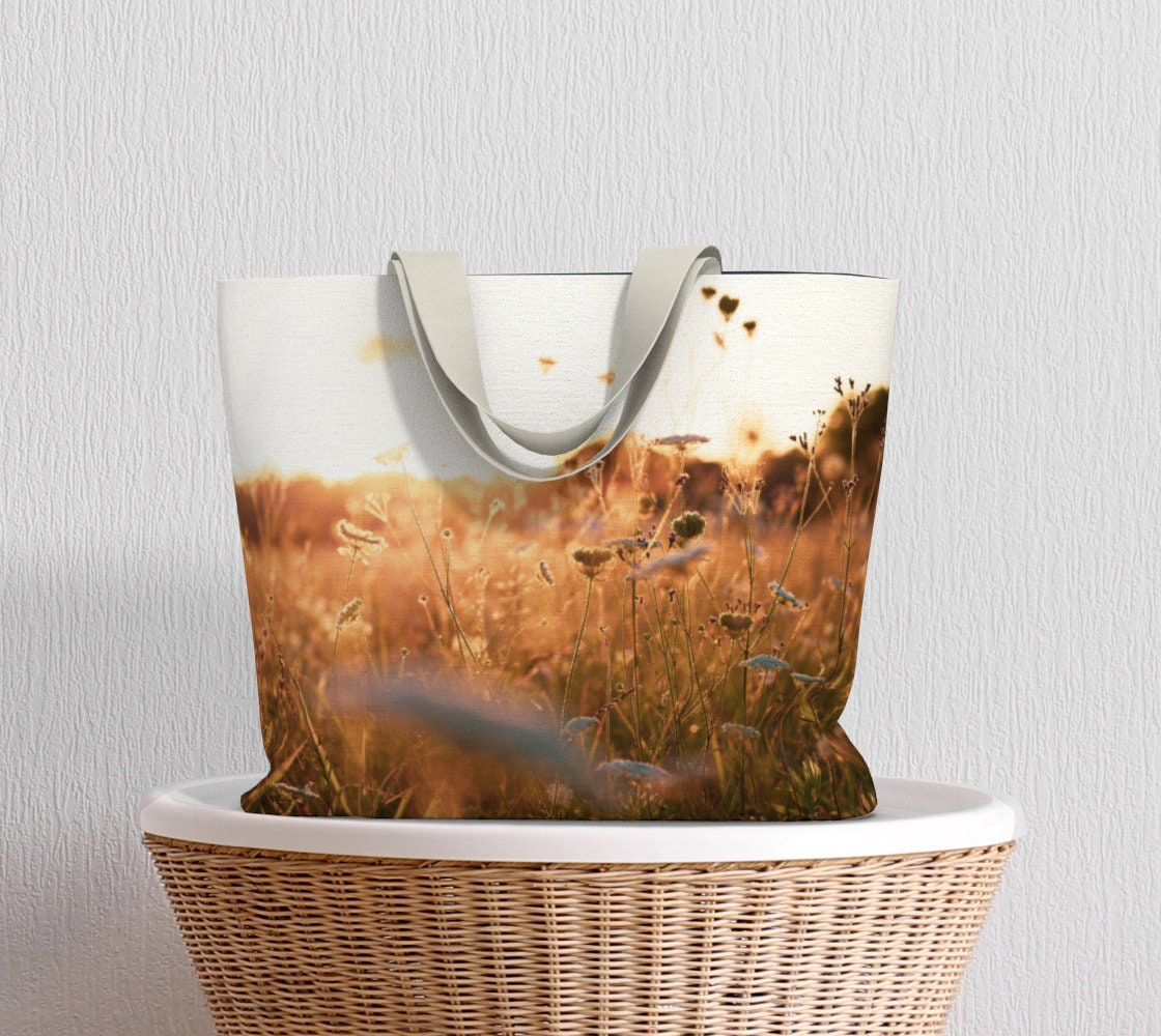 a tote bag with a field of queen annes lace
