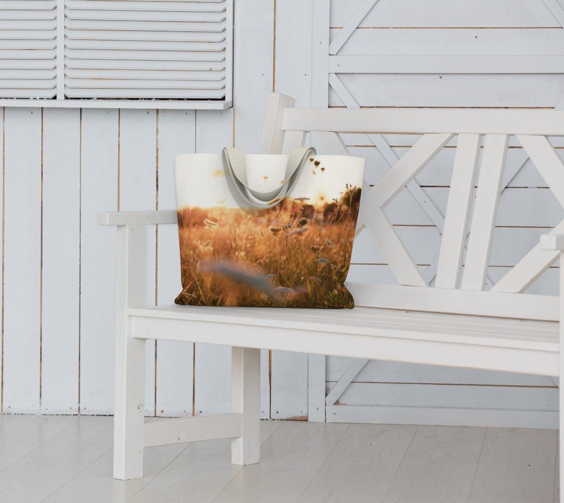 a tote bag with a field of queen annes lace