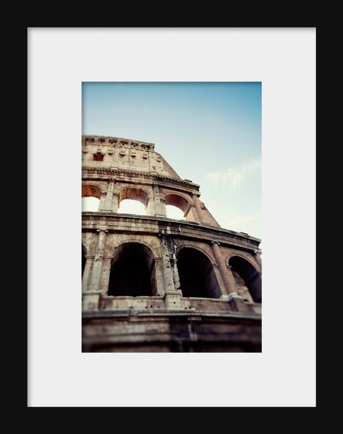 Exterior view of the Colosseum’s arches and stone facade in Rome, Italy