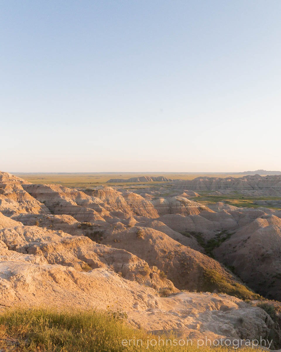 a man standing on top of a large rock formation