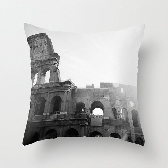 A black and white throw pillow cover featuring a printed image of the Roman Colosseum.