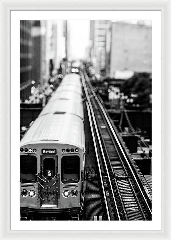 a framed black and white photo of a train in Chicago, Illinois on the tracks