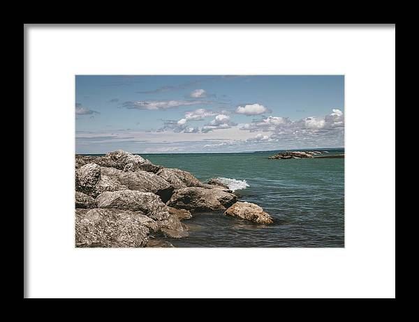 a view of the ocean from a rocky shore