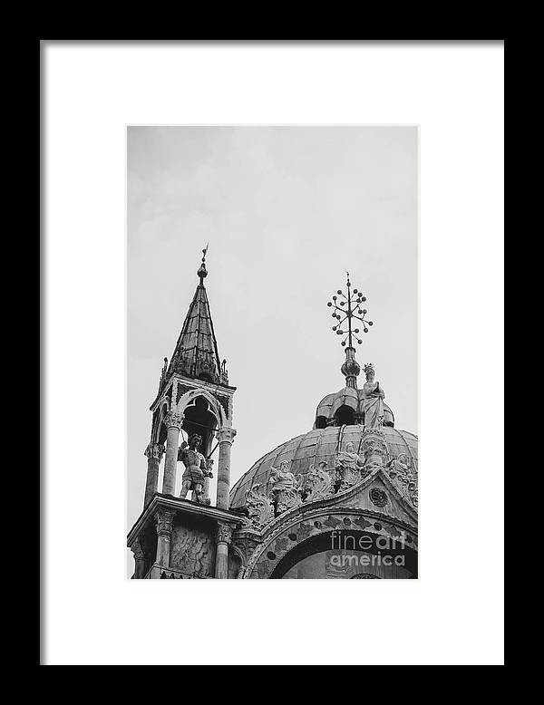a black and white photo of a building with a clock tower