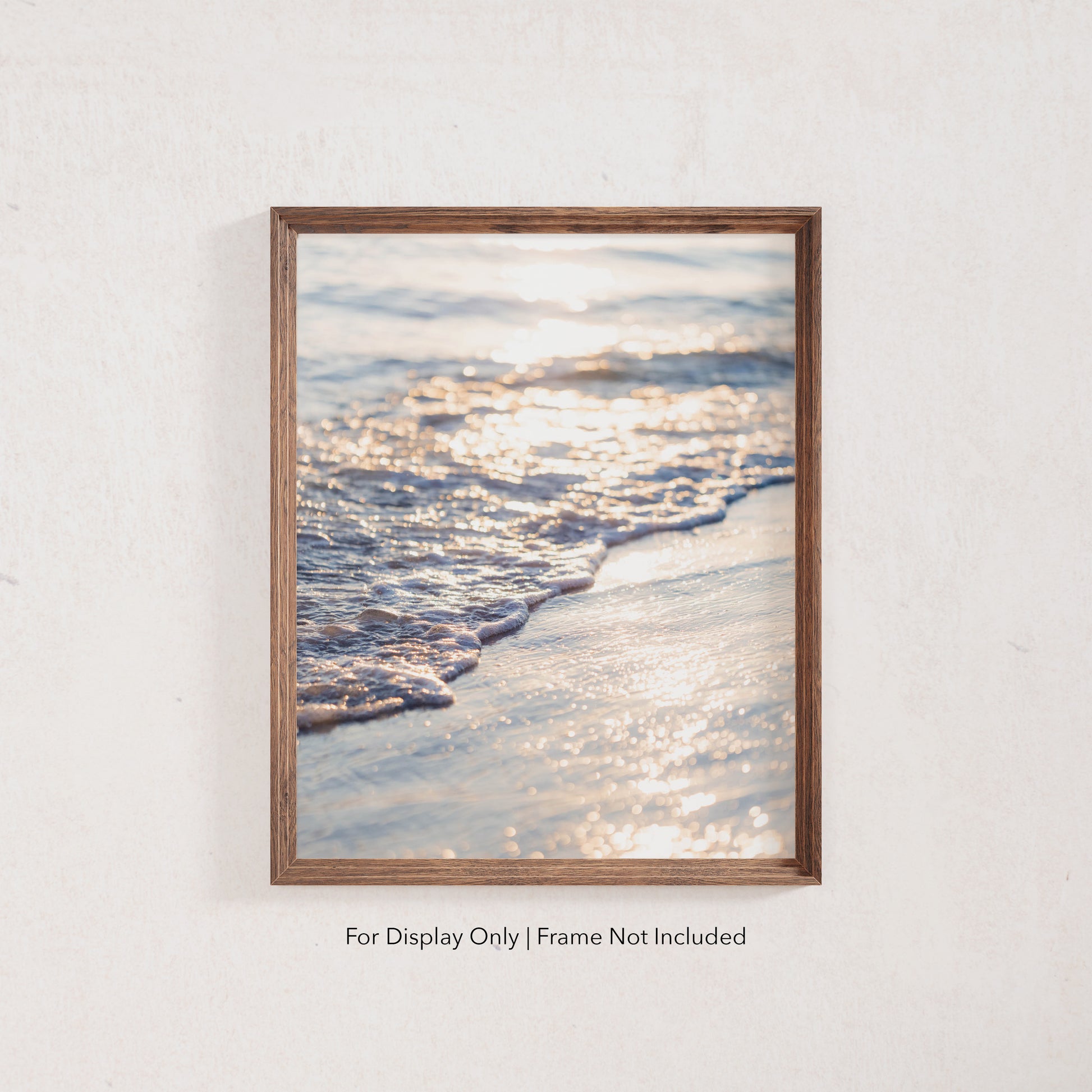 Ocean waves washing ashore in golden sunset light, coastal beach photography wall art.