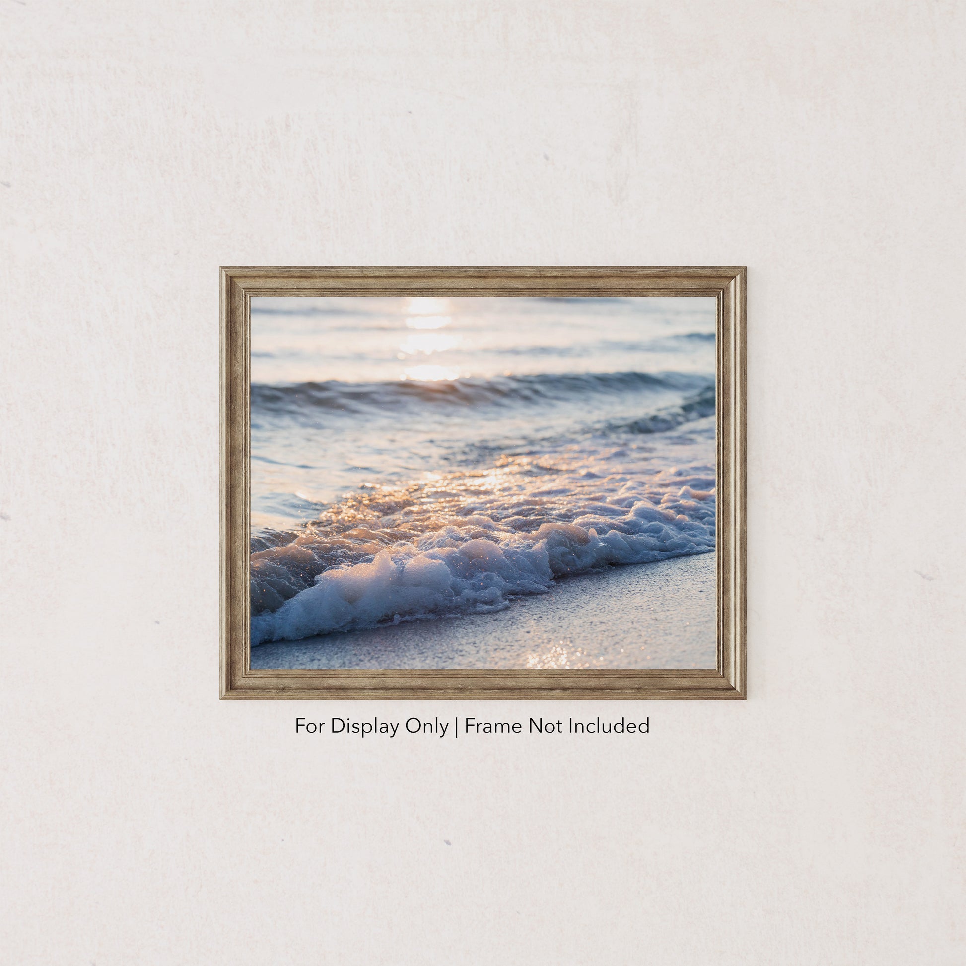 Foamy wave rolling onto the sandy beach in Destin, Florida, glowing in soft Gulf Coast sunlight.