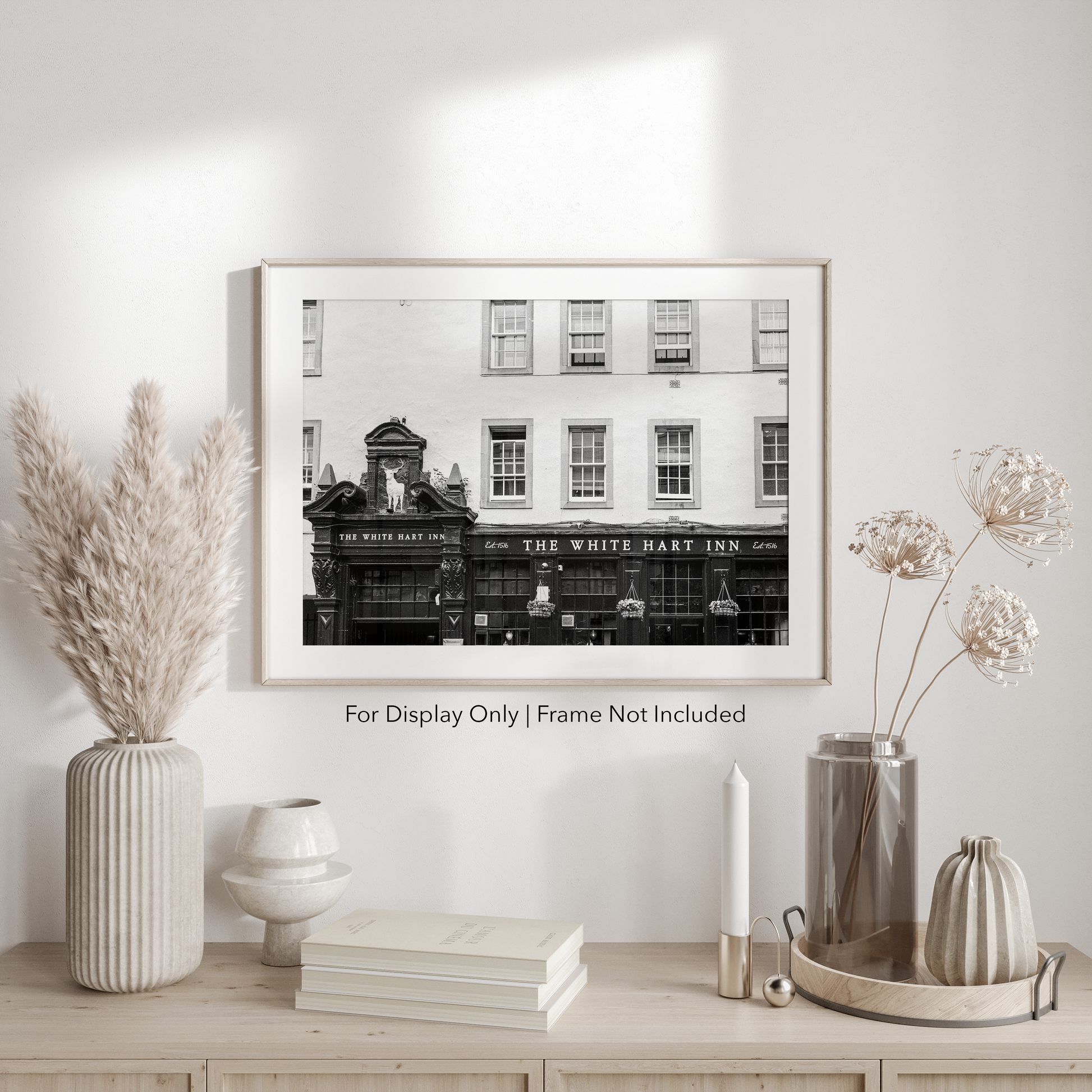 Black and white photograph of The White Hart Inn in Edinburgh Scotland featuring historic pub architecture and vintage signage.