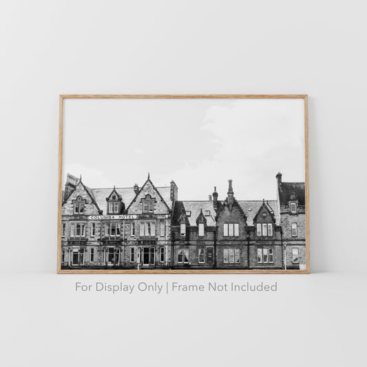 Black and white photograph of the historic Columba Hotel building in Inverness, Scotland, with stone architecture and gabled rooftops.