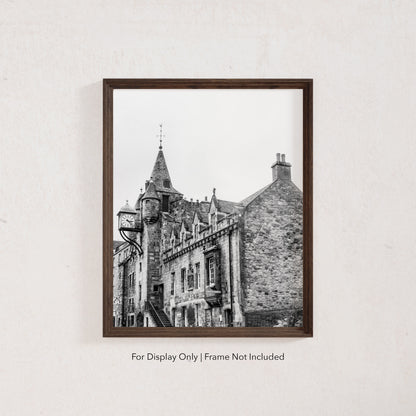 Black and white photograph of the Canongate Tolbooth clock tower on Edinburgh’s Royal Mile, historic stone building with Gothic details.