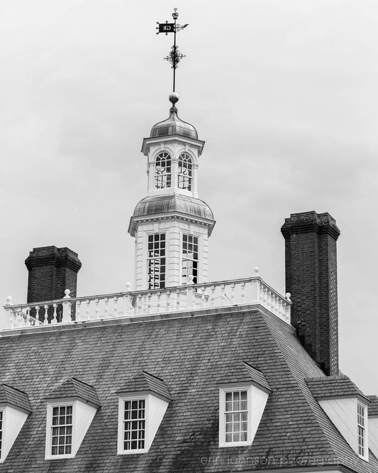 a black and white photo of a building with a steeple