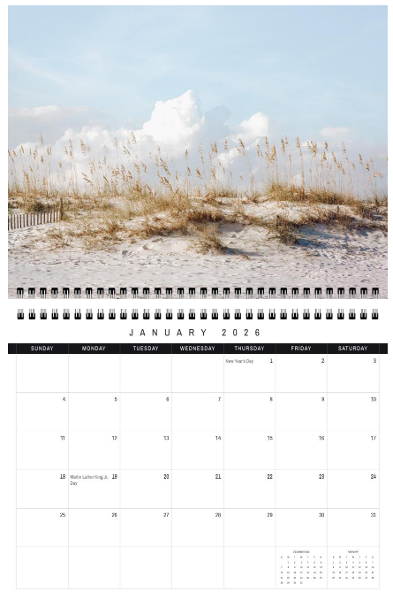 Calendar with a beach scene featuring sand dunes and reeds, with January 2023 displayed.