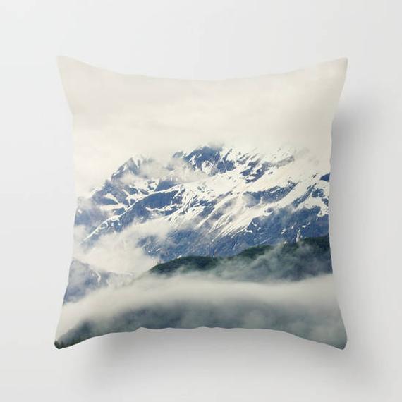 a pillow with a picture of a snowy mountain