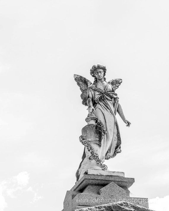 a black and white photo of a statue