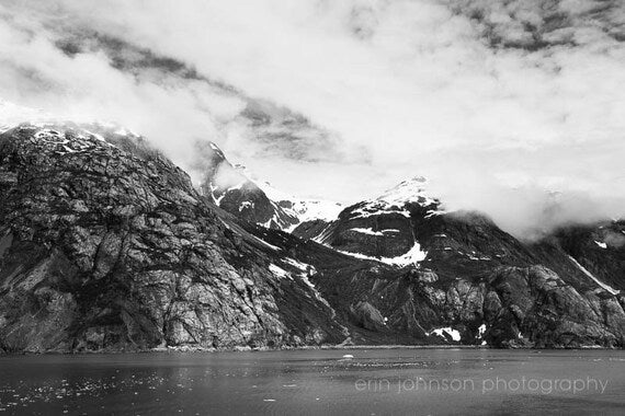 a black and white photo of a mountain range