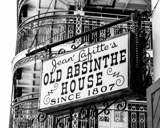 a black and white photo of a sign on a building