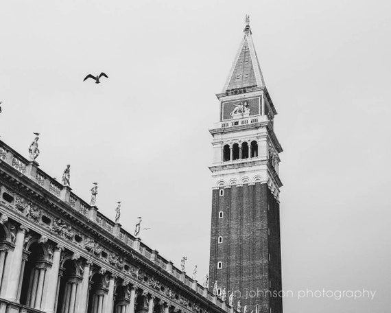 a black and white photo of a clock tower