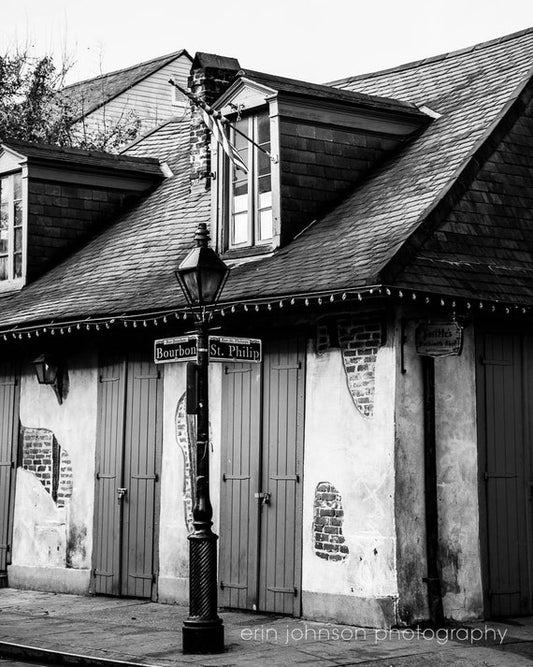 a black and white photo of a street corner