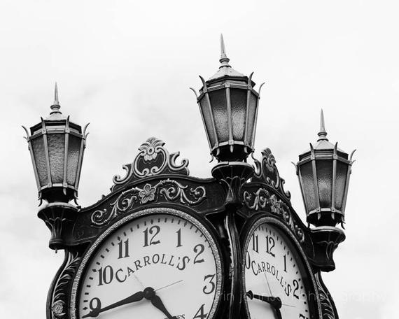a black and white photo of a clock tower