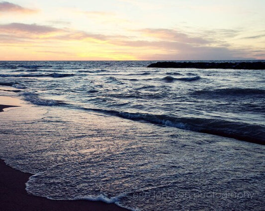 a beach with waves coming in to shore