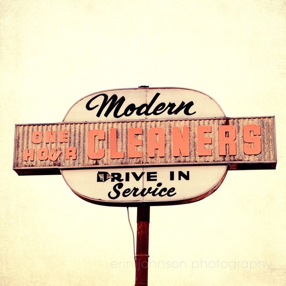 a sign for a cleaner's drive in service