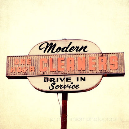 a sign for a cleaner's drive in service