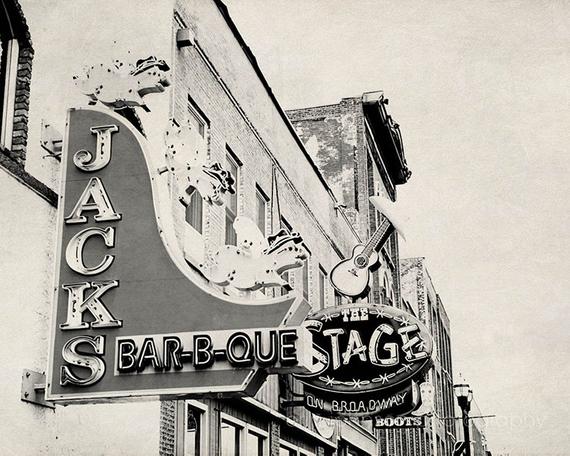 a black and white photo of a sign for jack's bar - b - q