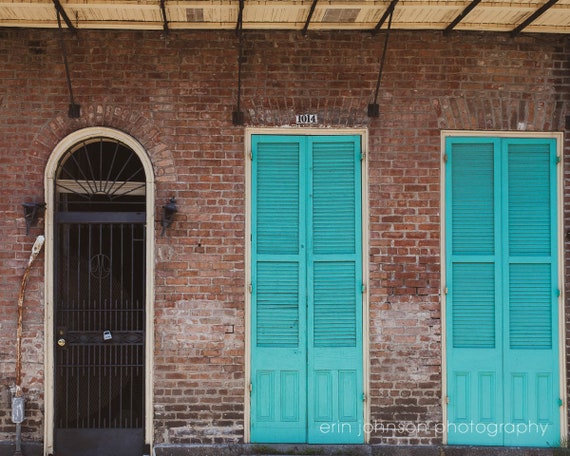 a couple of blue doors sitting next to each other