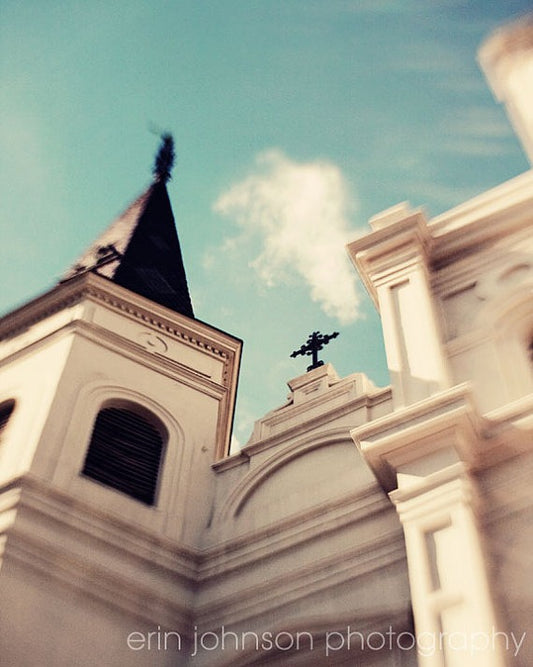a church steeple with a cross on top