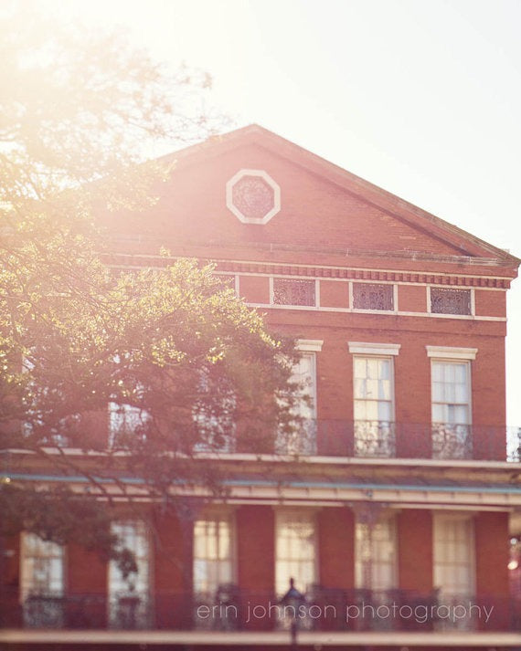 a large brick building with a clock on the top of it